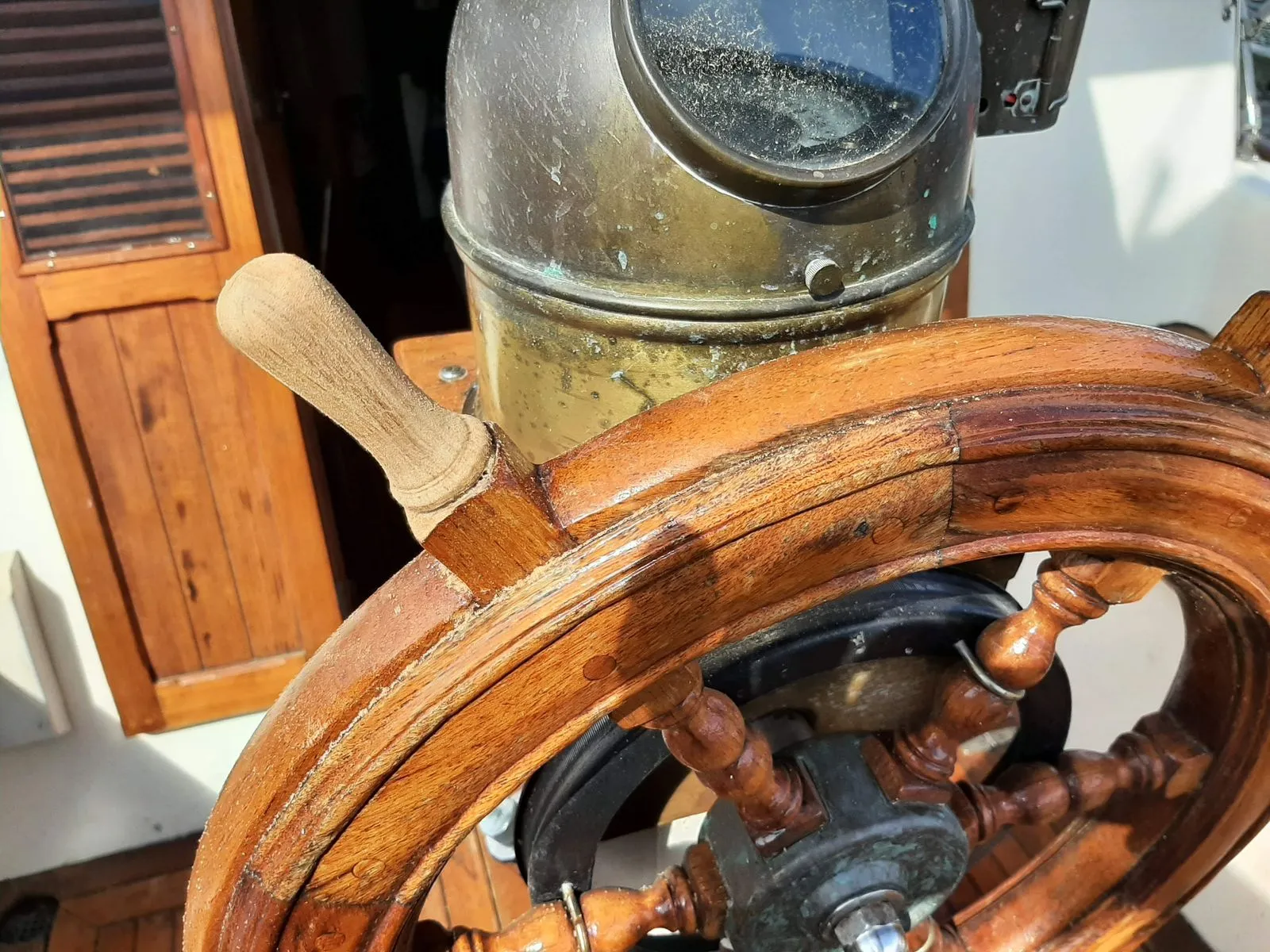 A restored wooden ship's wheel