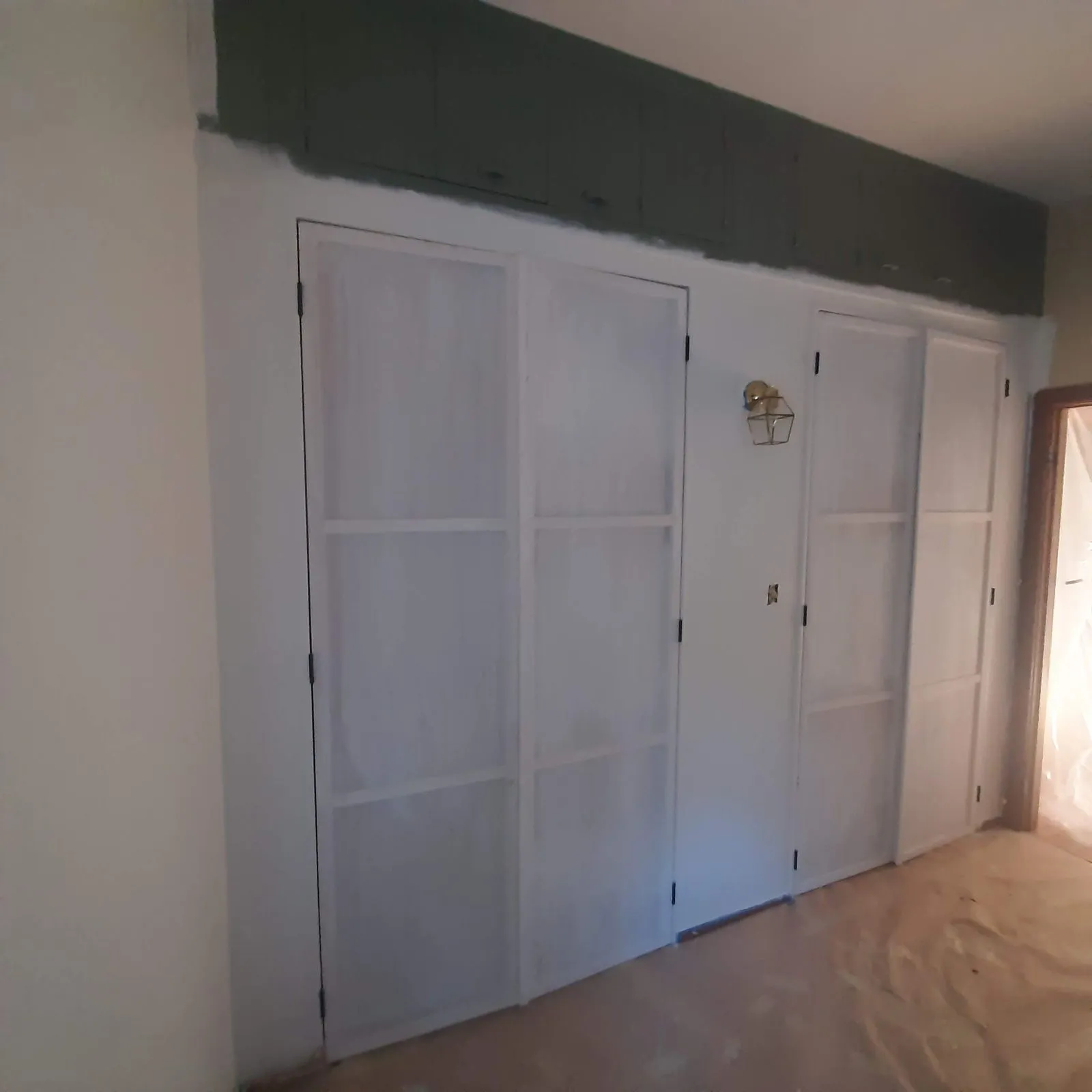 Panelled interior doors fitted in a hallway