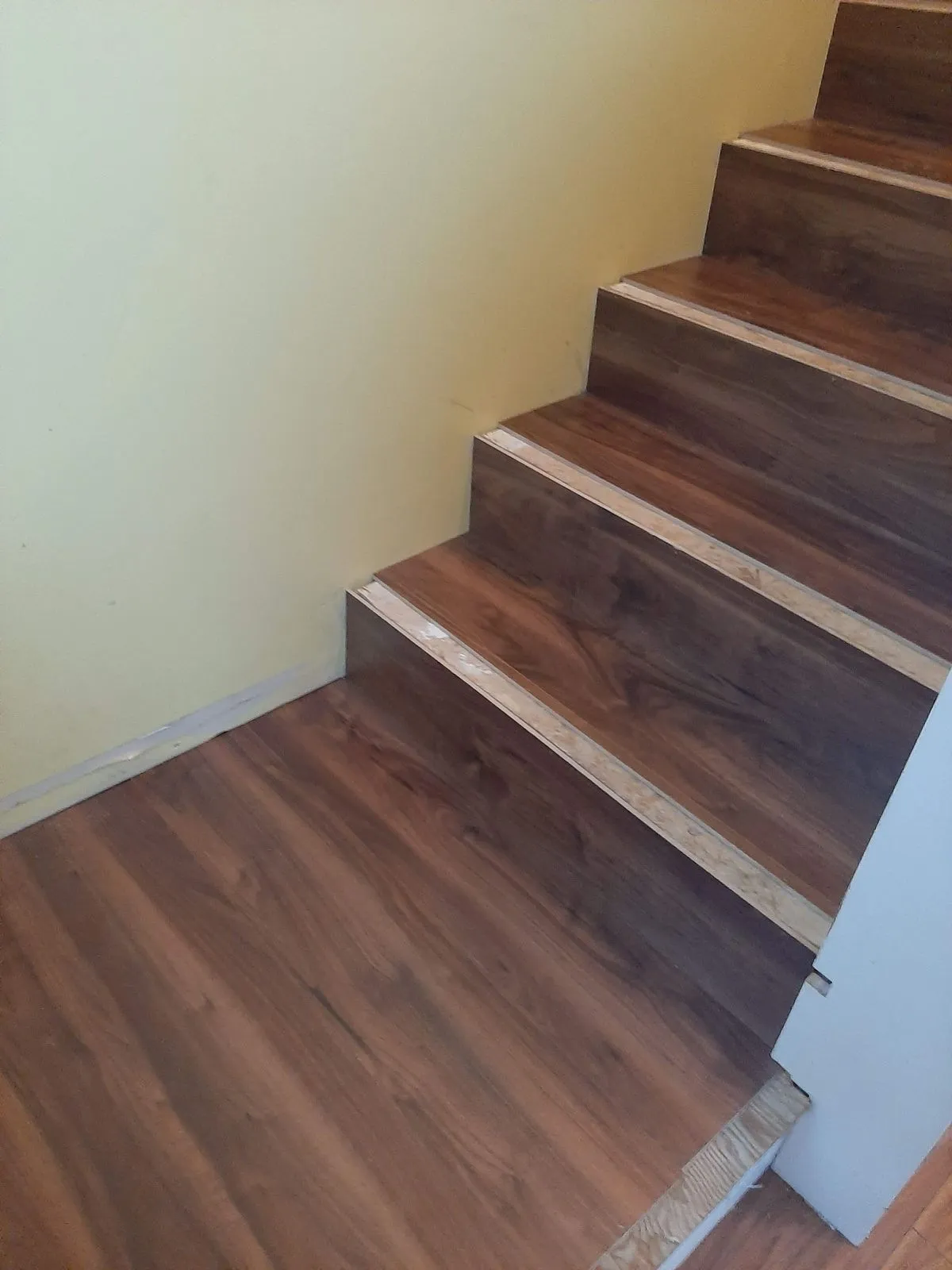 Finished hardwood stair treads with painted risers
