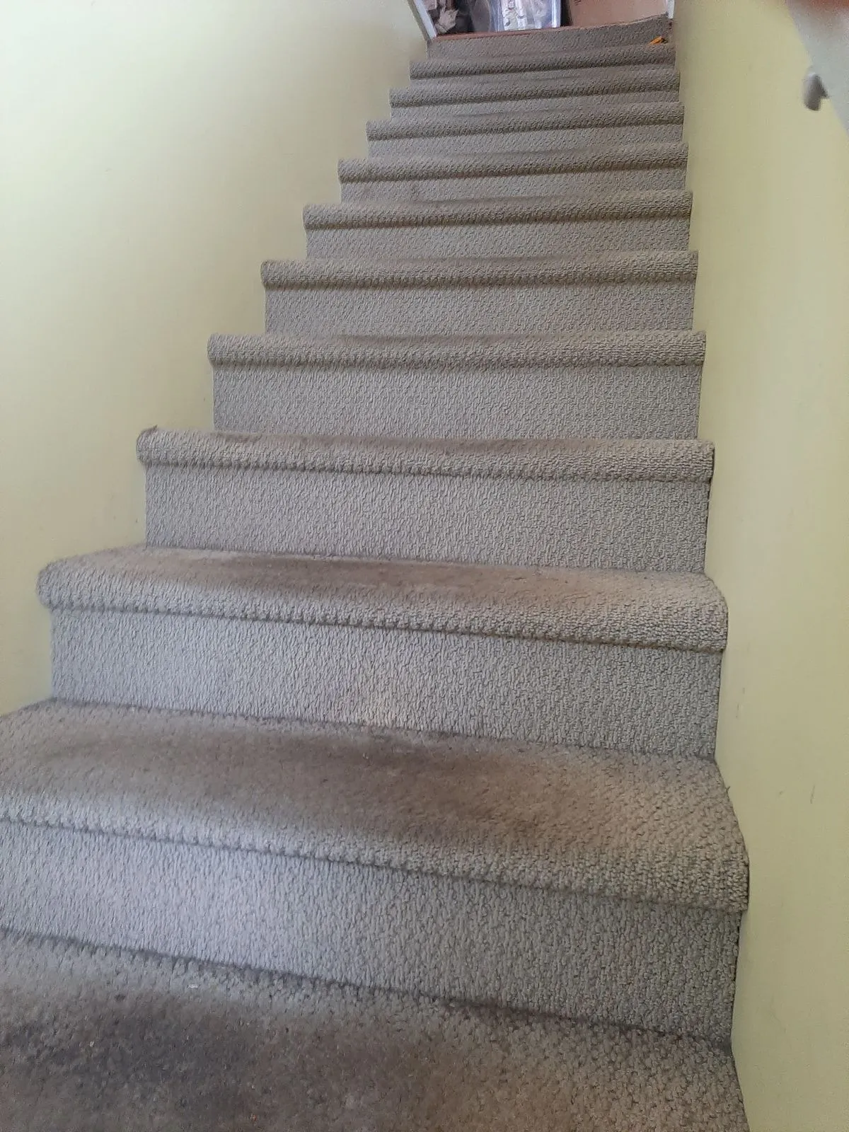 Worn stair treads stripped back before new hardwood was fitted